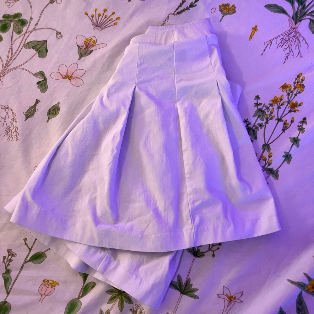 White mini pleated skirt.